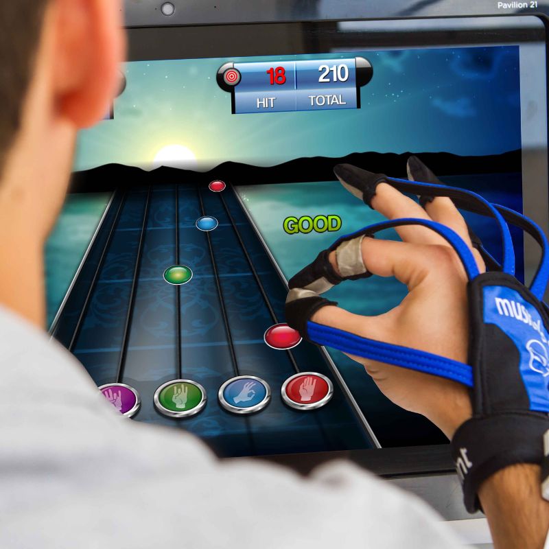 man playing with musicglove rehab device and program for stroke and brain injury recovery