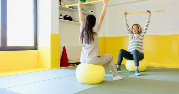 woman being shown coordination exercises for stroke patients after her stroke