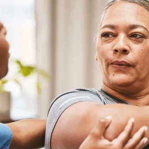 stretching exercises for ms being demonstrated by a therapist