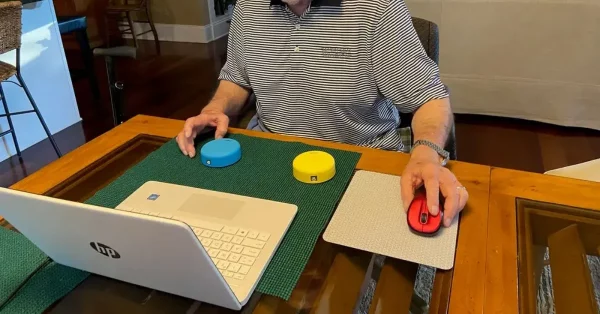 man using game to improve adherence to stroke rehab