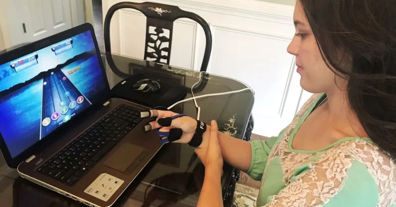 best rehab tools for upper vs lower body after stroke or tbi being demonstrated by woman