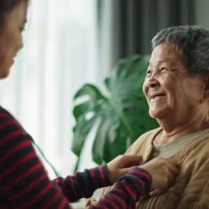 woman dressing after stroke using help