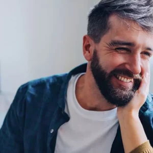 male brain injury survivor talking to his mom