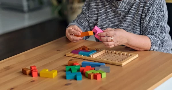 woman doing a cognitive activity to test her memory after brain injury