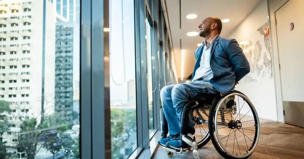 man with c5 spinal cord injury looking out the window
