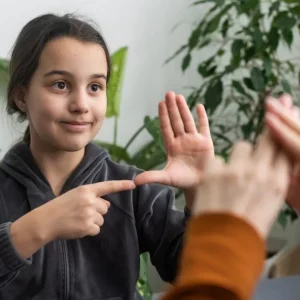 little girl practicing aphasia exercises with mother who had a stroke