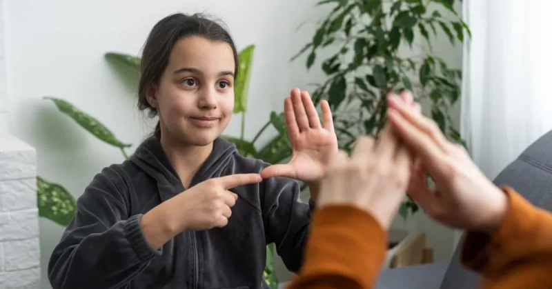 little girl practicing aphasia exercises with mother who had a stroke
