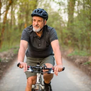 man riding bike as a daily habit to boost his stroke recovery