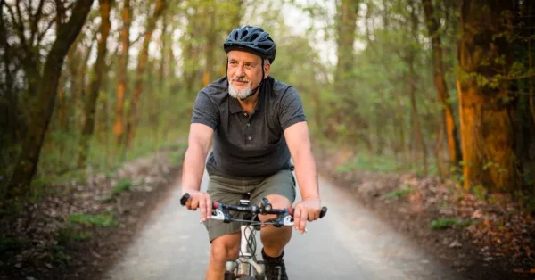 man riding bike as a daily habit to boost his stroke recovery