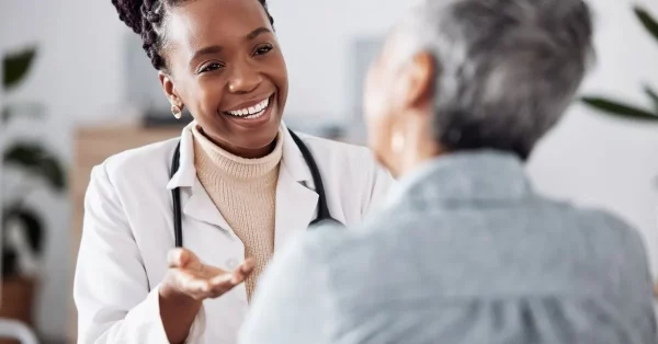 woman asking a question to her doctor after a stroke