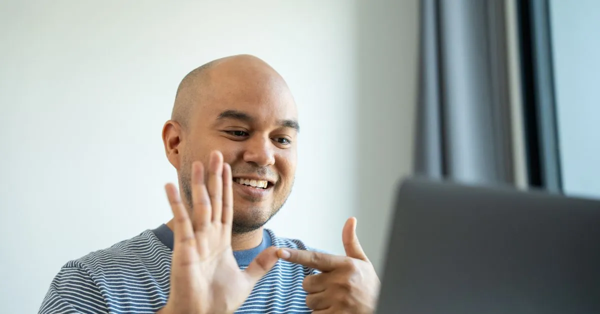 man on virtual physical therapy video call with therapist