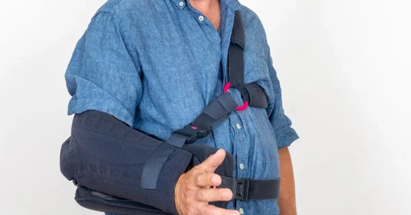 man using constraint induced movement therapy cimt
